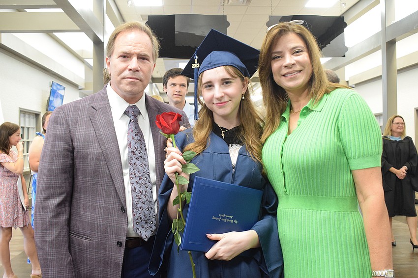 Joe Millin and his wife, Deborah Millin, are proud of Out-of-Door Academy graduate Olivia Millin (center), who will go onto Villanova University.