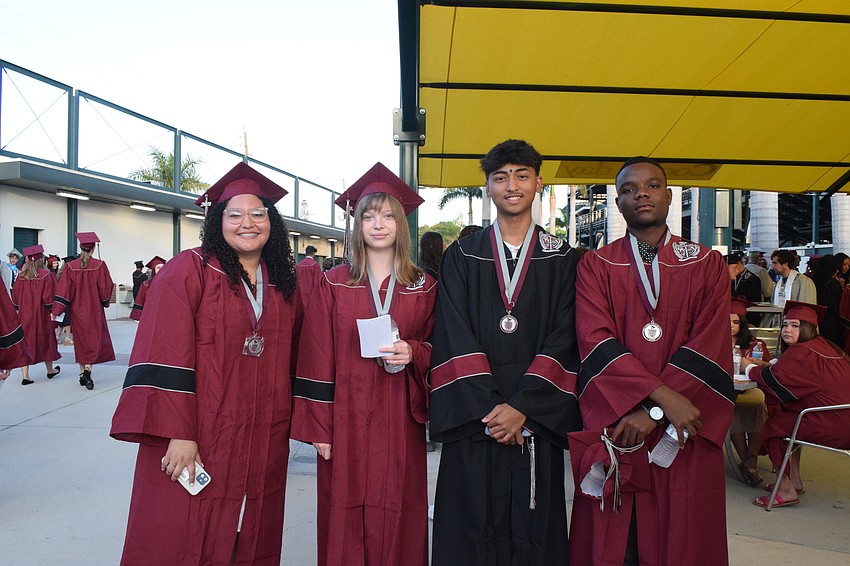 Braden River High School's Guadalupe Calzada, Imagyn Laraway, Mikhail Kusumo and Jules Bruno are happy and relieved to make it to graduation day.