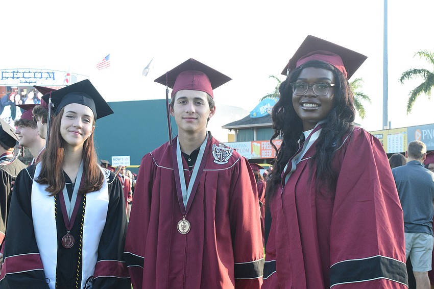 Braden River High School's Julianna Chupp, Donovan Cinelli and Amanda Cineus are lined up for the ceremony.