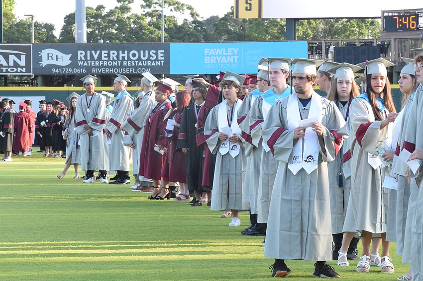 Braden River High School graduates line up.