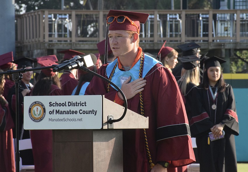 Braden River High School's Stuart Macaulay leads everyone in the Pledge of Allegiance.