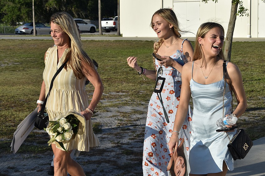 Brooke Hann heads to the stadium with Anna Ourednik and Saylor Hann.