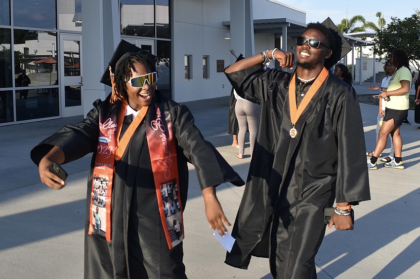 Cymari Brewer and Caleb Bradley dance as they prepare for graduation.