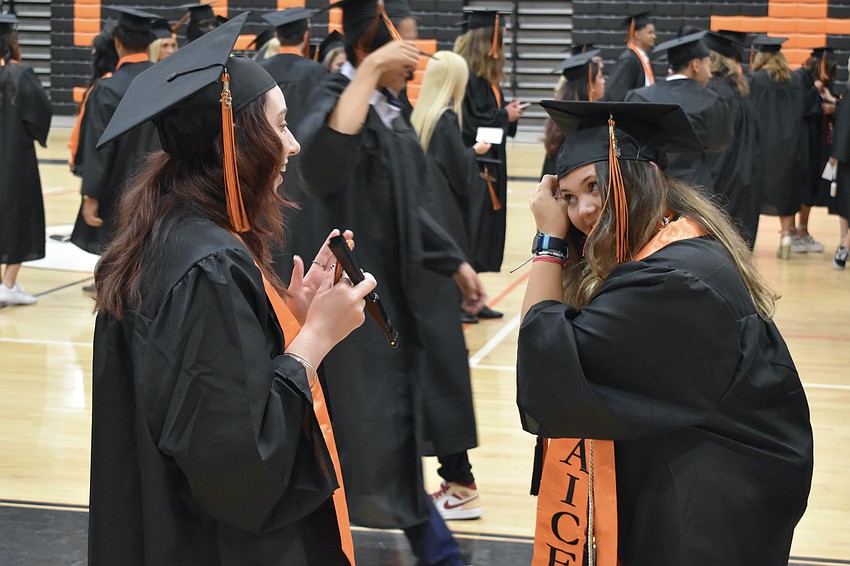 Taylor Wertz and Lucia Warren prepare for the ceremony.