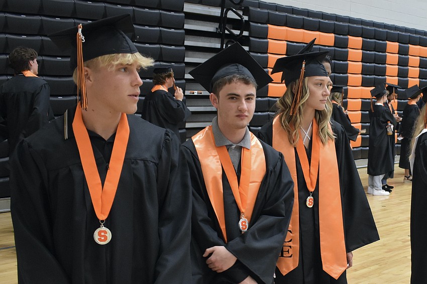 Neritan Selaj, Ben Shereff, and Valerie Shore prepare to walk to the stadium.