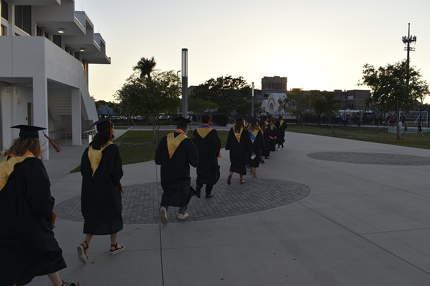 Graduates proceed to Cleland Stadium for the graduation ceremony.