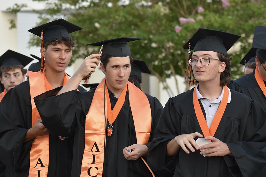Charles Edgson, Thomas Dye, and David Dutka chat as they wait to enter the stadium.