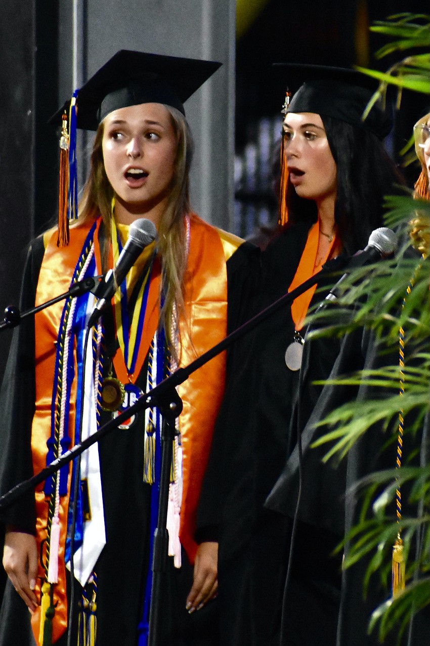 Sarah Pascual and Anna Smith were among the students who sang the nationl anthem.