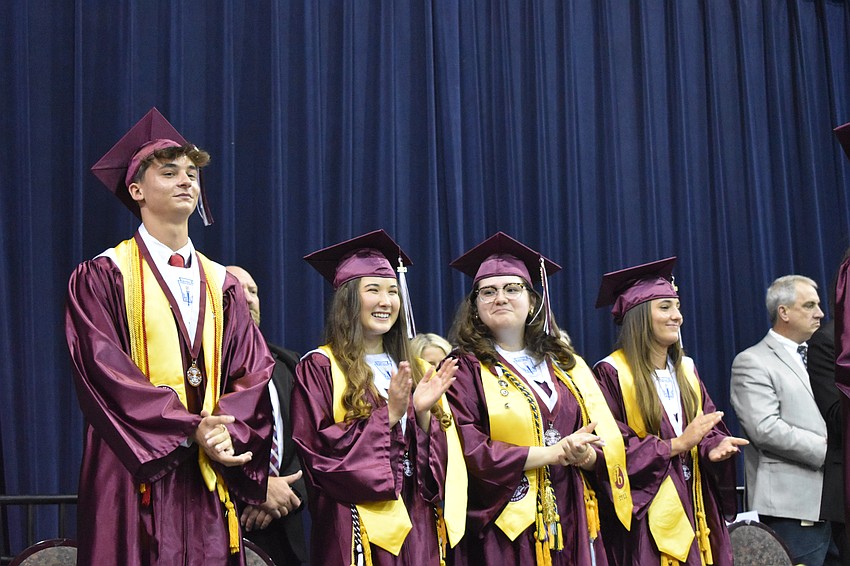 Senior class Historian Cayman Reisky, Treasurer Lilly Mae Stewart, Secretary Emily Lepow, and Vice President Emily O'Neill are introduced.