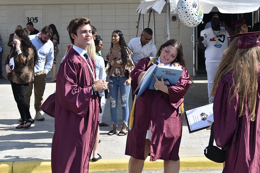 Jon Cerrito has his yearbook signed by Angelina Massucco.