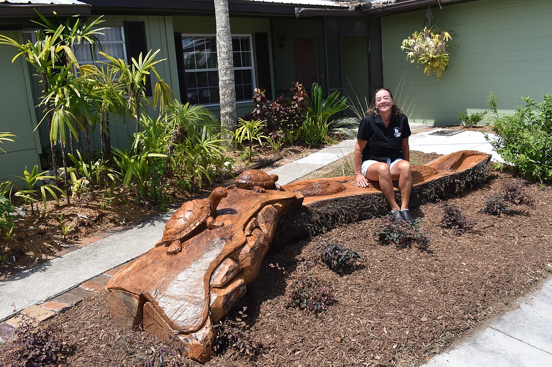 This bench in front of Linger Lodge was made from a slab of oak from a tree that was uprooted during Hurricane Ian.
