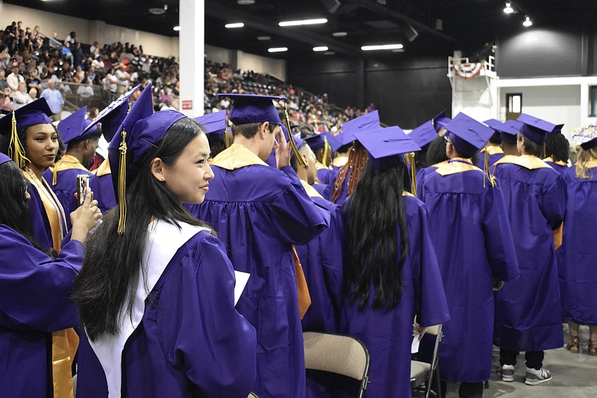Julia Wren Grandpre and other students enter the auditorium.
