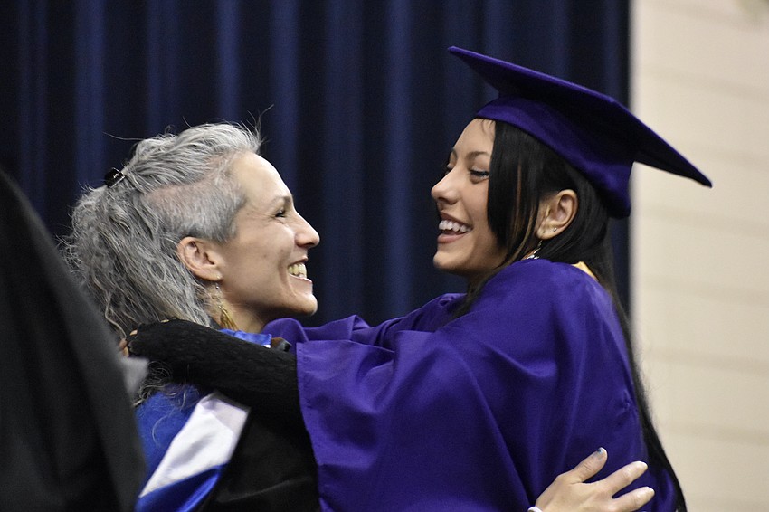 Sarasota County High School and Booker High School Teacher of the Year Courtney Smith greets Briana Cristiani