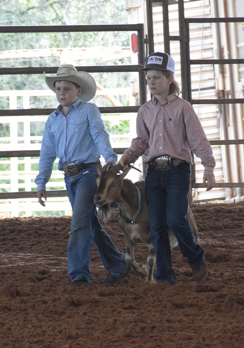 Mason Roberts and Gage Yates help set up different events for the rodeo.