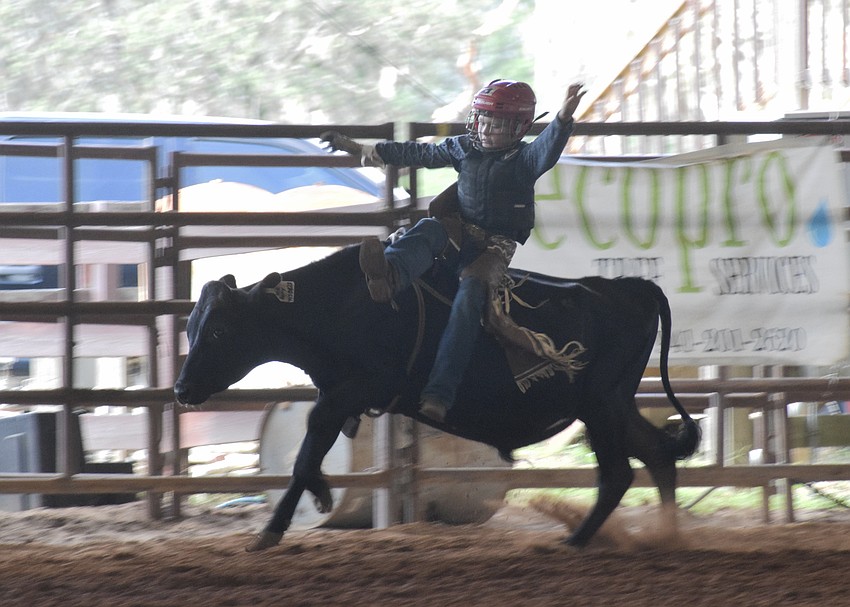 Cason Pankey jumps off the bull before it bucks him off.