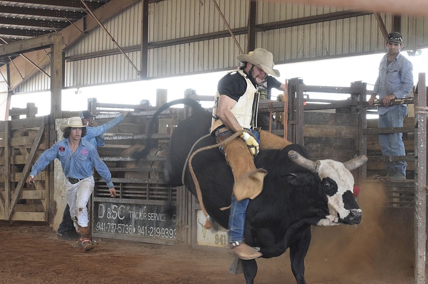 Caleb Zeitler stays on a bull for as long as he can before it bucks him off.