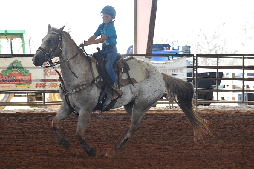 Myakka City Elementary School third grader Macie Connours competes in pole bending.
