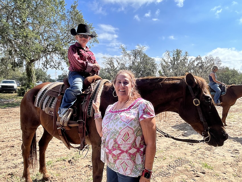 Myakka City Elementary School second grader Marshyll Scott has the chance to show her teacher, Jackie Blue, her rodeo skills.