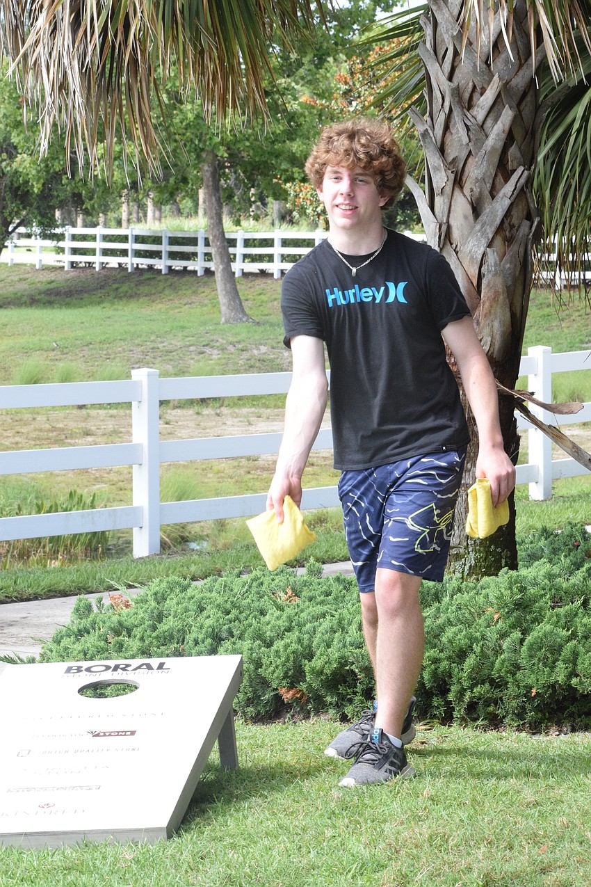 David Ellingson, a Lakewood Ranch Preparatory Academy freshman, has fun playing cornhole.