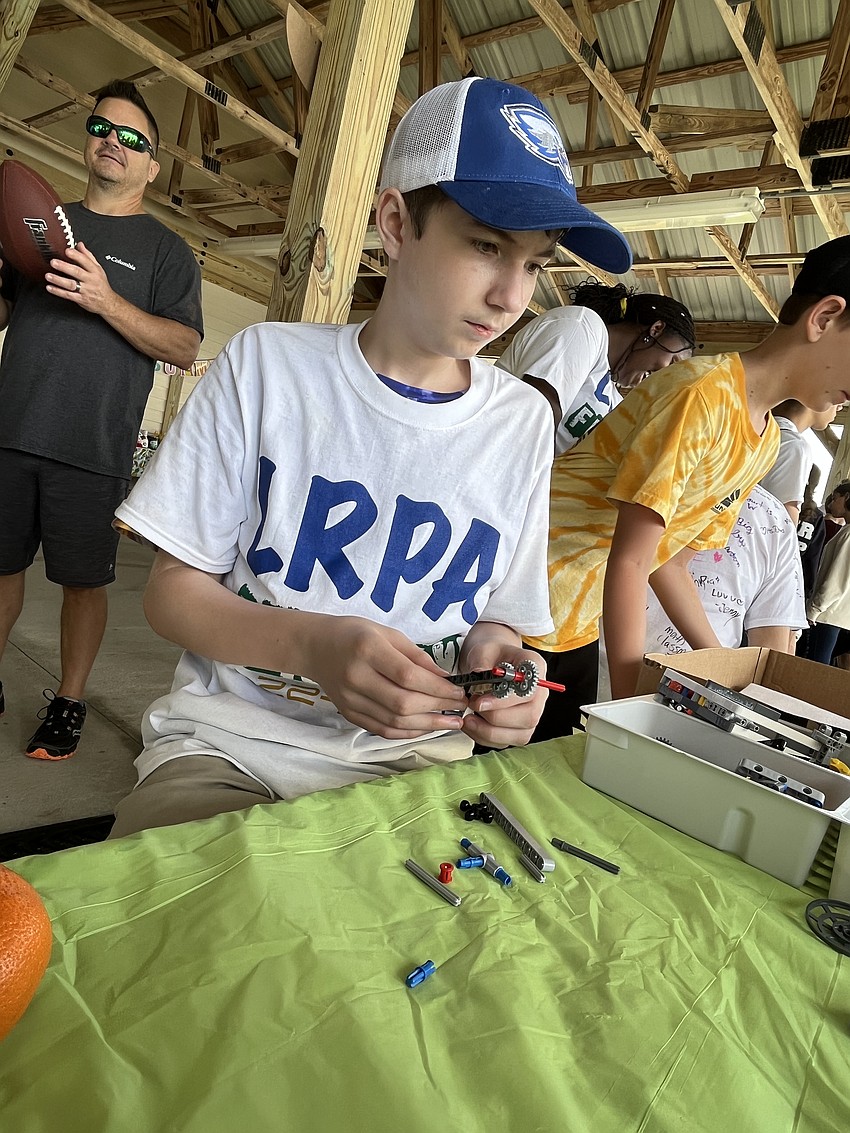 Lakewood Ranch Preparatory Academy freshman John Conn works on building a mechanical arm.