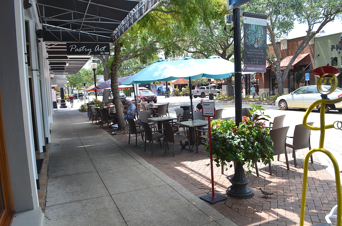 If approved, a new ordinance will increase an annual fee paid by downtown restaurants with sidewalk cafe permits by $3 per square foot of outside space used for additional sidewalk and alley cleanings.
