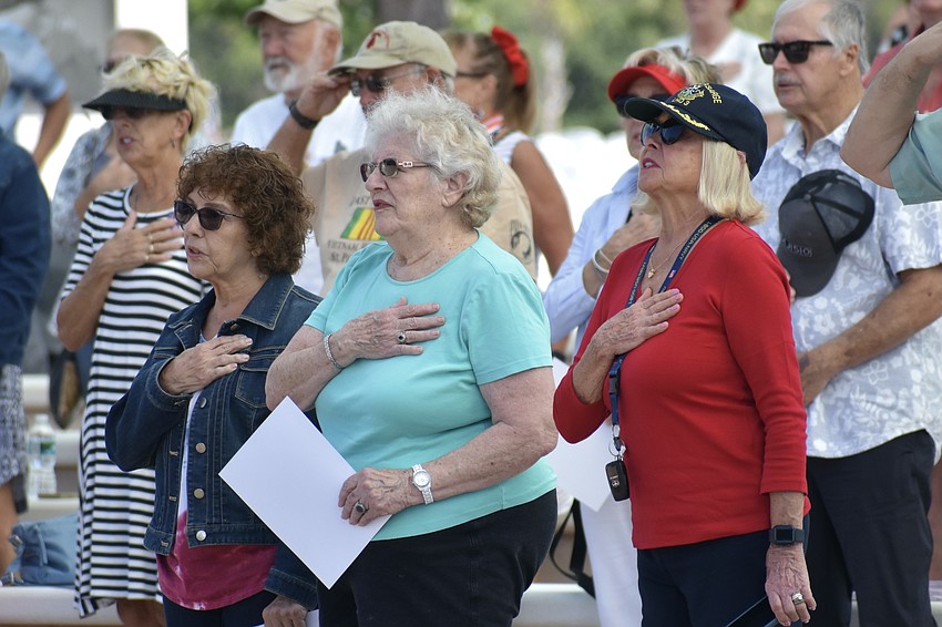 Linda Russo, Sandy Bellomo, and Hope Byrns sing the Star Spangled Banner.