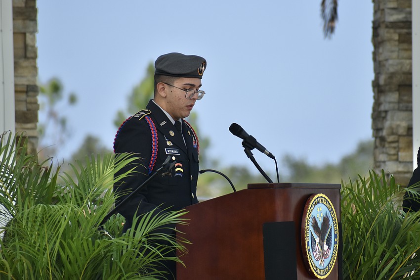 Sarasota Military Academy cadet Akiel Reyes Melendez speaks at the podium.