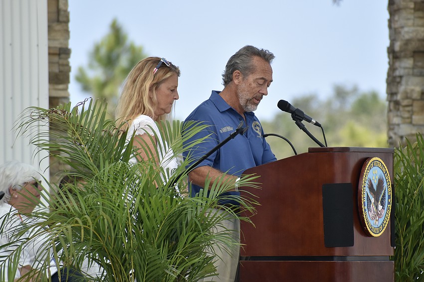 Englewood's Mitch and Shannon Mesenburg speak in honor of their son, Senior Airman XinHua Mesenburg.
