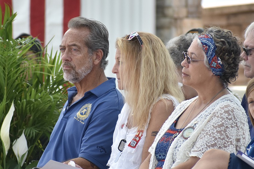 Gold Star parents Mitch and Shannon Mesenburg and Yolanda Mercado listen to a performance of 