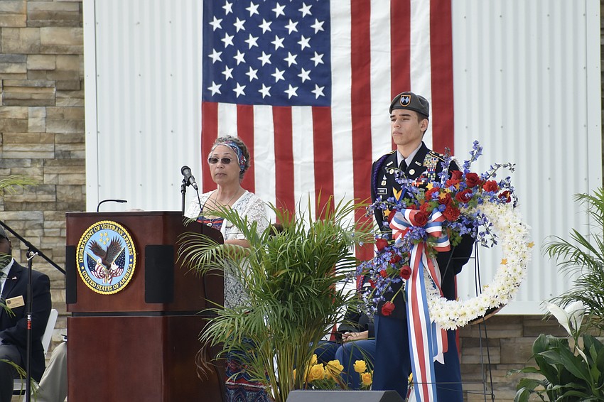 Yolanda Mercado speaks in honor of her son Jalfred D. Vaquerano, alongside Sarasota Military Academy cadet Raphael Fabyanic.