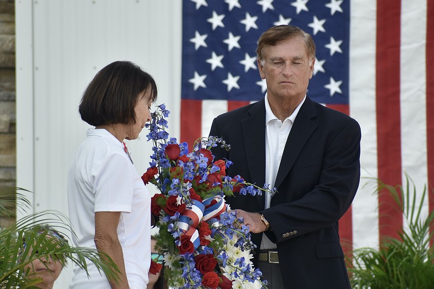 Gold Star parents Kathy and Steve Combs take a moment of silence as they are presented with the Wreath of Remembrance in honor of their son, Lt. Steven Combs Jr.
