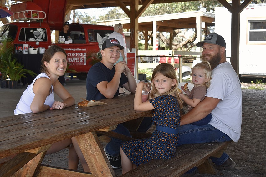 Elizabeth, Preston, Graceyn, Remy and Josh Hostetler share a property line with the farm, but this is their first visit to the market.