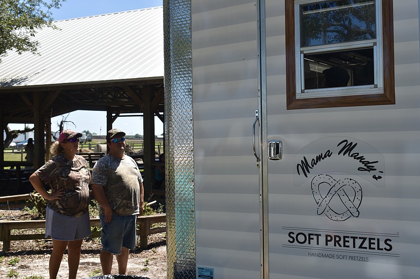 Edna and Ruben Hoover are so close to the farm, they drove their golf cart to get some handmade pretzels from Mama Mandy's.
