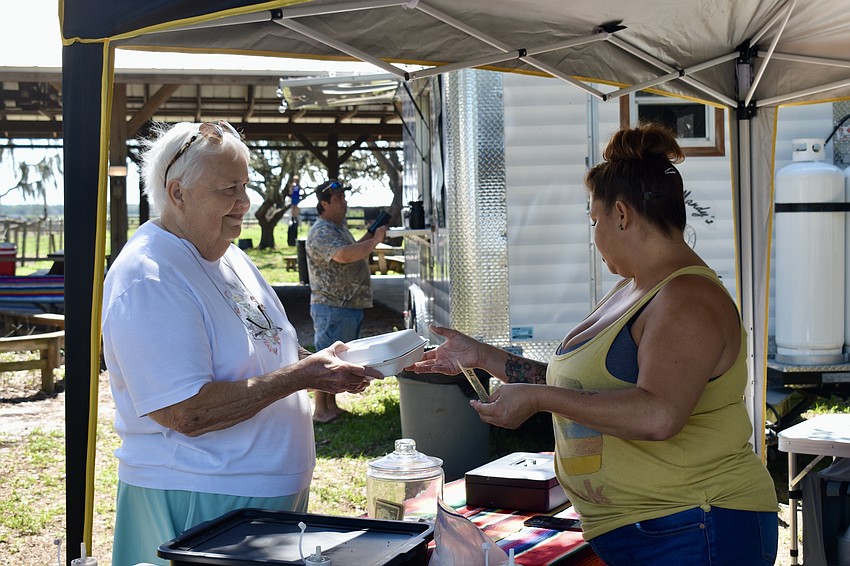 Bradenton resident Mary McCoy orders beef enchiladas from Angie Banuelos. Chuco's serves El Paso-style dishes that are made from family recipes.