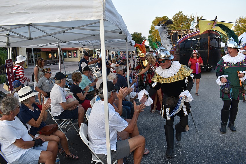The Crewe of Hernando DeSoto greet the veterans in the VIP seating section at the end of the Tribute to Heroes Parade.