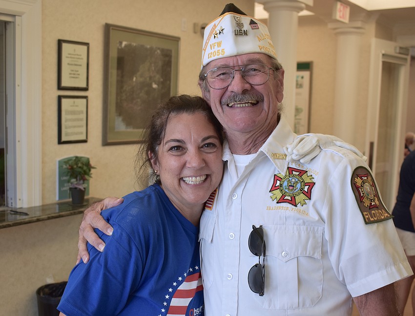 East County Observer Associate Publisher Lori Ruth gets a big hug from Graham Ellis of Braden River VFW Post 12055 during a special dinner for the veterans at Lakewood Ranch Town Hall. Ruth helps organize the dinner.