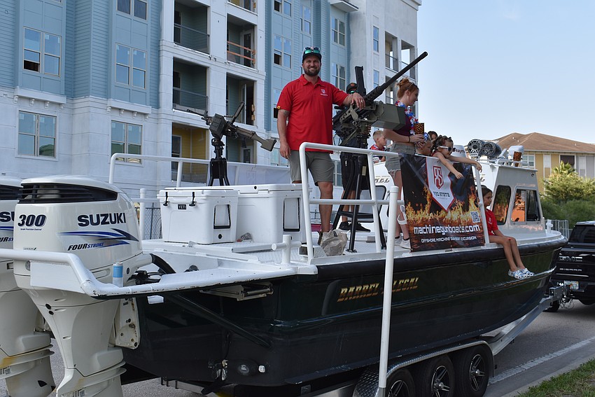 Levi Courtney, a Marine Corps veteran, rode with his boat through the parade. His Palmetto-based Red State Armory offers 