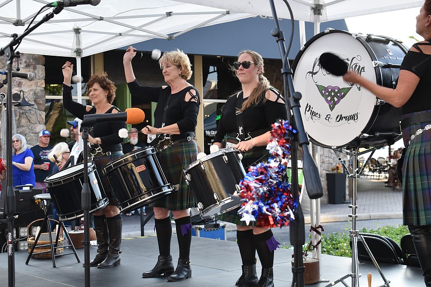 Blue Skye Pipes and Drums entertains the crowd on Lakewood Main before the parade.