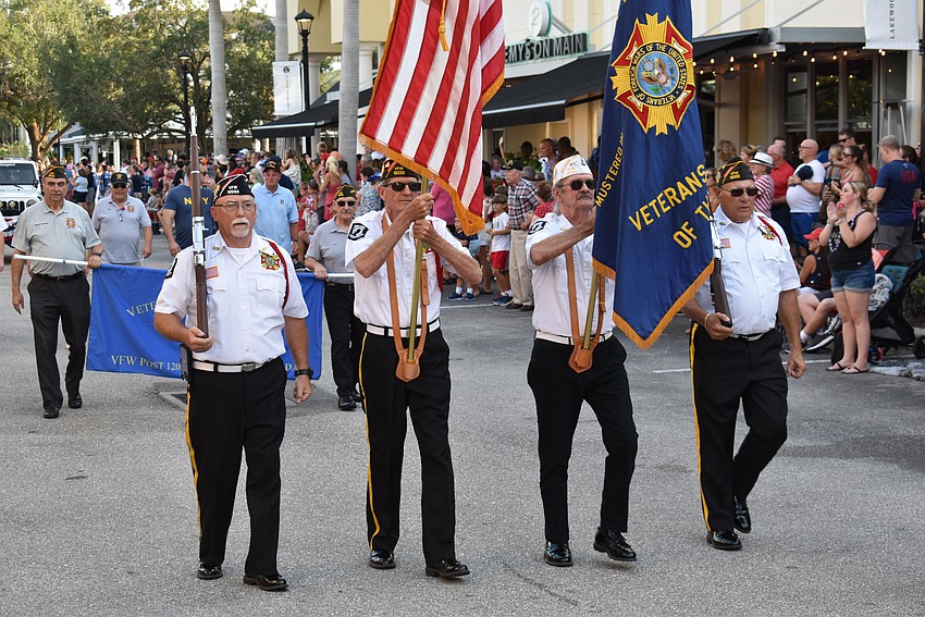 Dave Daily, Ken Green, Graham Ellis and Chuck Slenker, all of Braden River VFW Post 12055, serve as the honor guard during the Tribute to Heroes Parade in Lakewood Ranch.