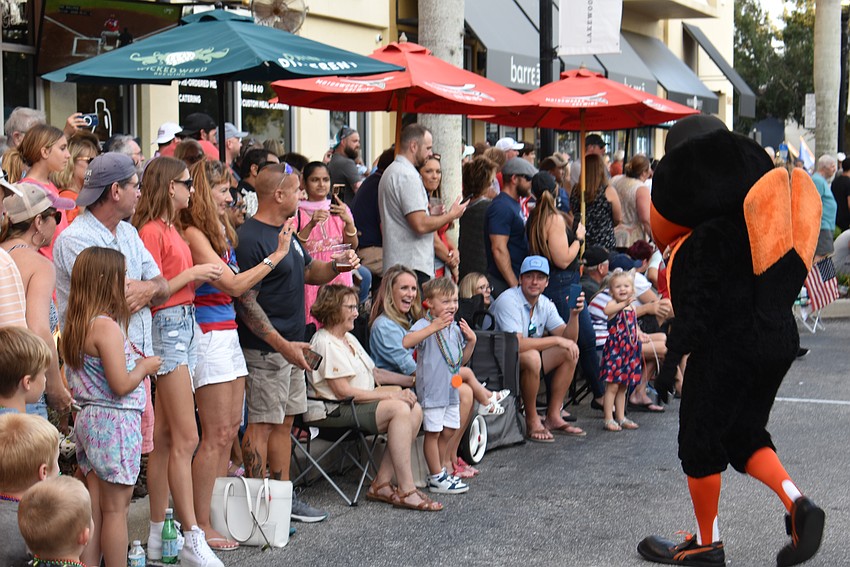 Lakewood Ranch's Carter Allen, 4, stands with his mom Lindsey Allen and gets a thrill from the Baltimore Orioles mascot.