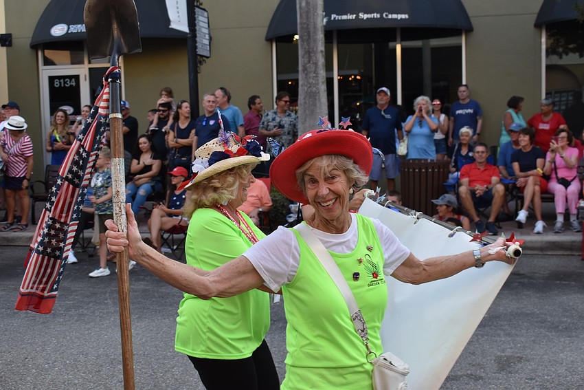 The Lakewood Ranch Garden Club's Anita Machlin enjoys her march down Lakewood Main Street during the Tribute to Heroes Parade.
