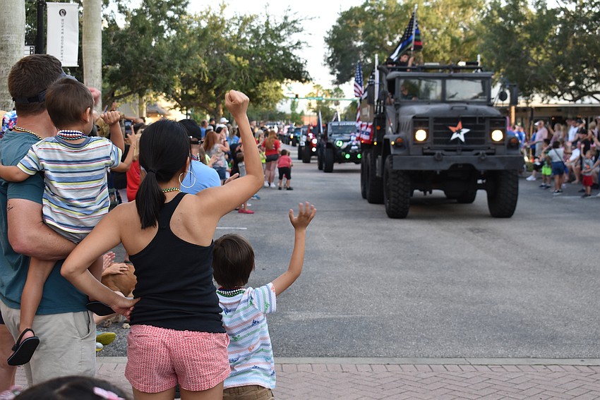 A line of heavy duty vehicles were cheered on by those in attendance.