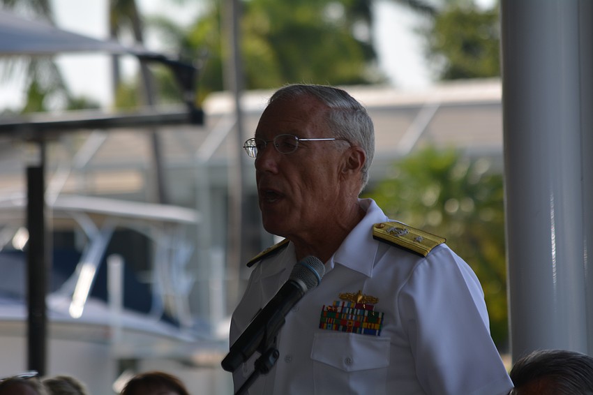 Steve Horton, vice commodore of the Bird Key Yacht Club and a retired U.S. Navy rear admiral, presents the 