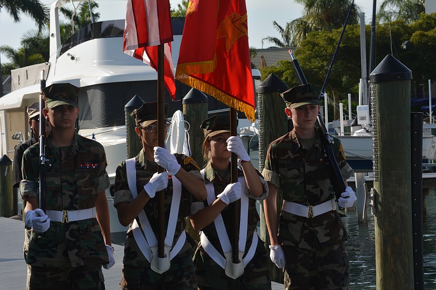 Young Marines from the Imagine School at North Port retire the colors.