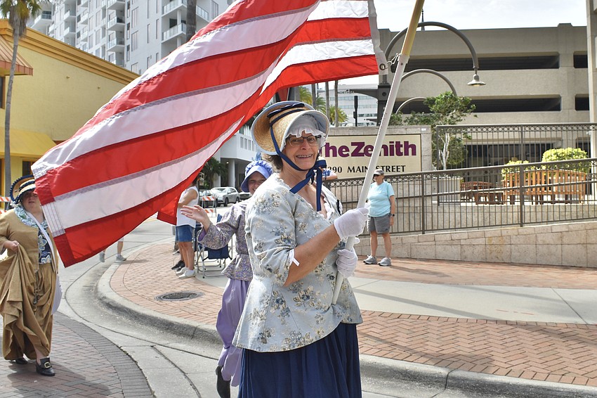 Colleen Page marches with Daughters of the American Revolution.