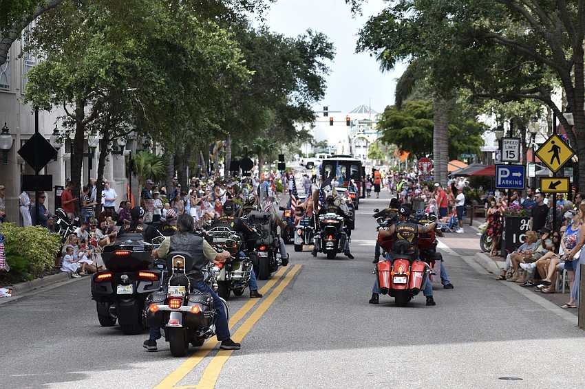 Motorcycle riders head down Main Street towards J.D. Hamel Park.