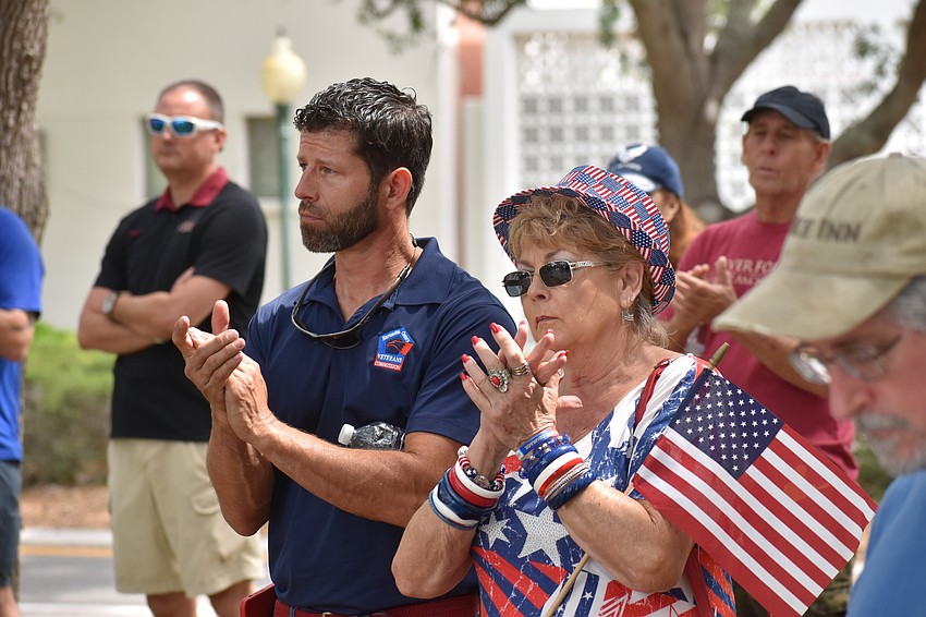 Aaron and Linda Burkett applaud during the ceremony.