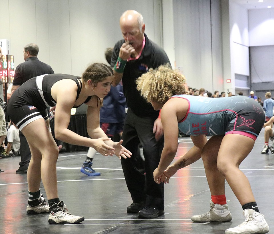 FPC's Ana Vilar, left, prepares to wrestle in a match at the Spartan Nationals in Tampa on May 19. Photo by Rachel Mills