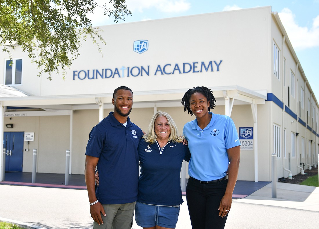 Denzel Irvin and Krystal Thomas-Smith will help during the transition of athletic directors after Lisa Eaves, center, leaves and the school hires a replacement.