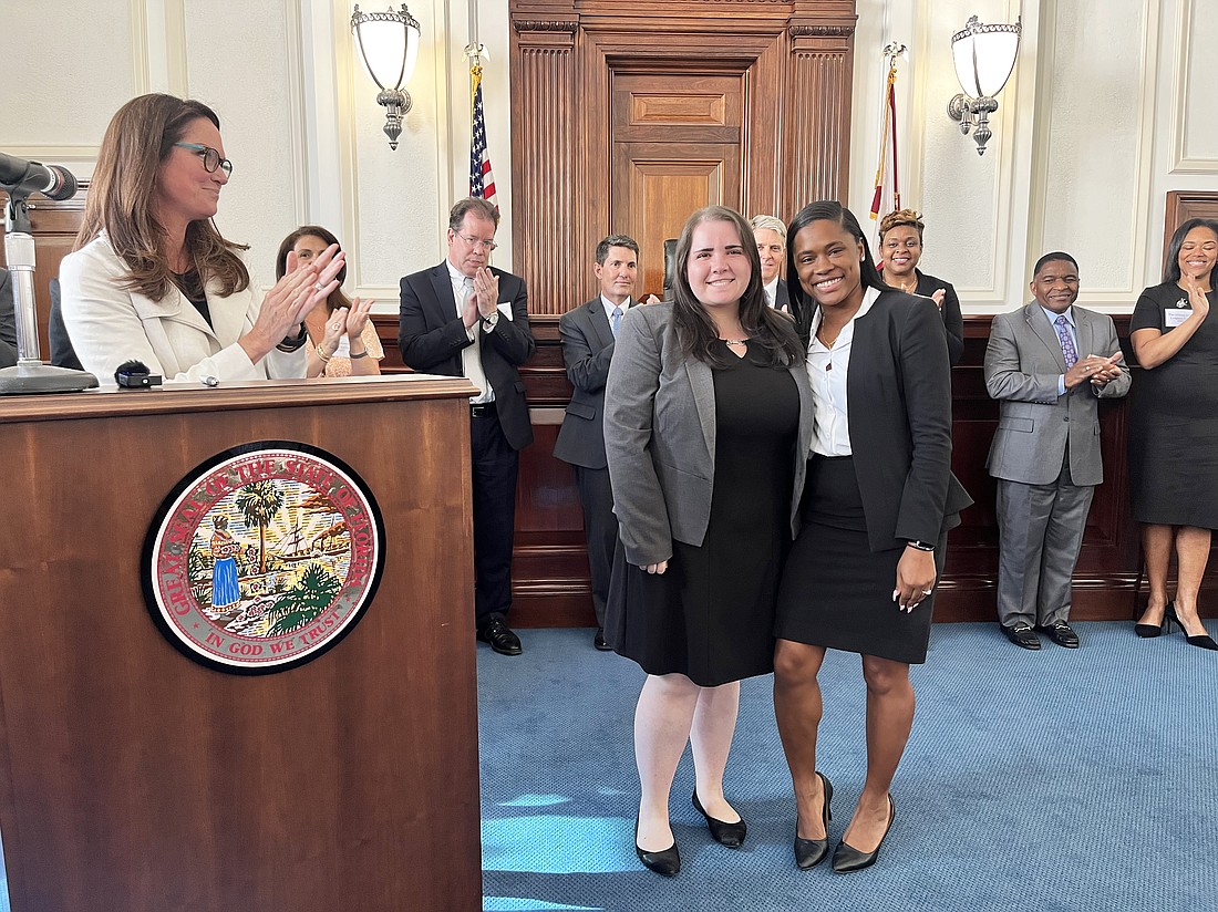 Flanked by past winners, State Attorney Melissa Nelson welcomes Jennifer Braunstein and Jalisa Curtis as the office’s 2022 Rookie of the Year recipients. The ceremony was held May 3 after the office’s annual office awards.